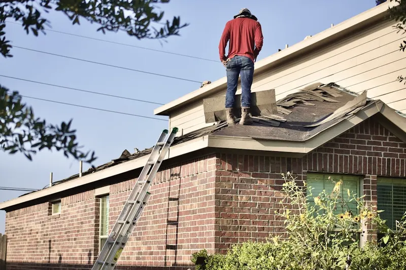 Professional roofer working on a residential roof in Destin Harbor